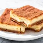 cinnamon sugar churro cheesecake bars - featured image