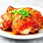 sticky honey sriracha chicken thighs - featured image