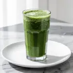 creamy tropical pineapple coconut green smoothie - featured image